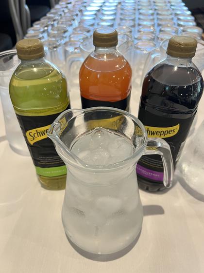 Juice and water on the refreshments table before the meeting starts