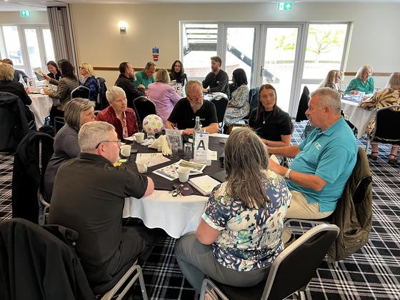 A round table of members mid discussion