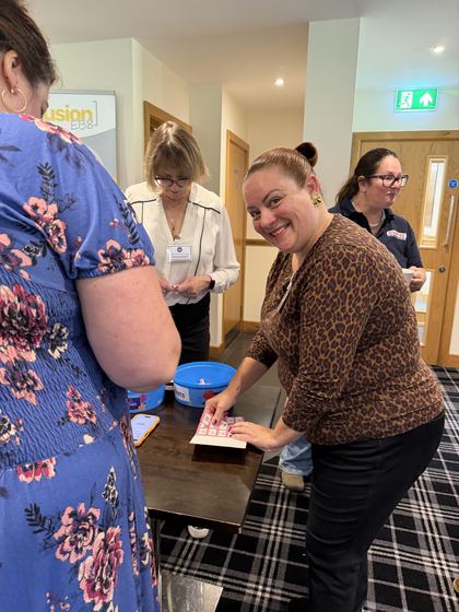 A member buying raffle tickets at the sign-in table